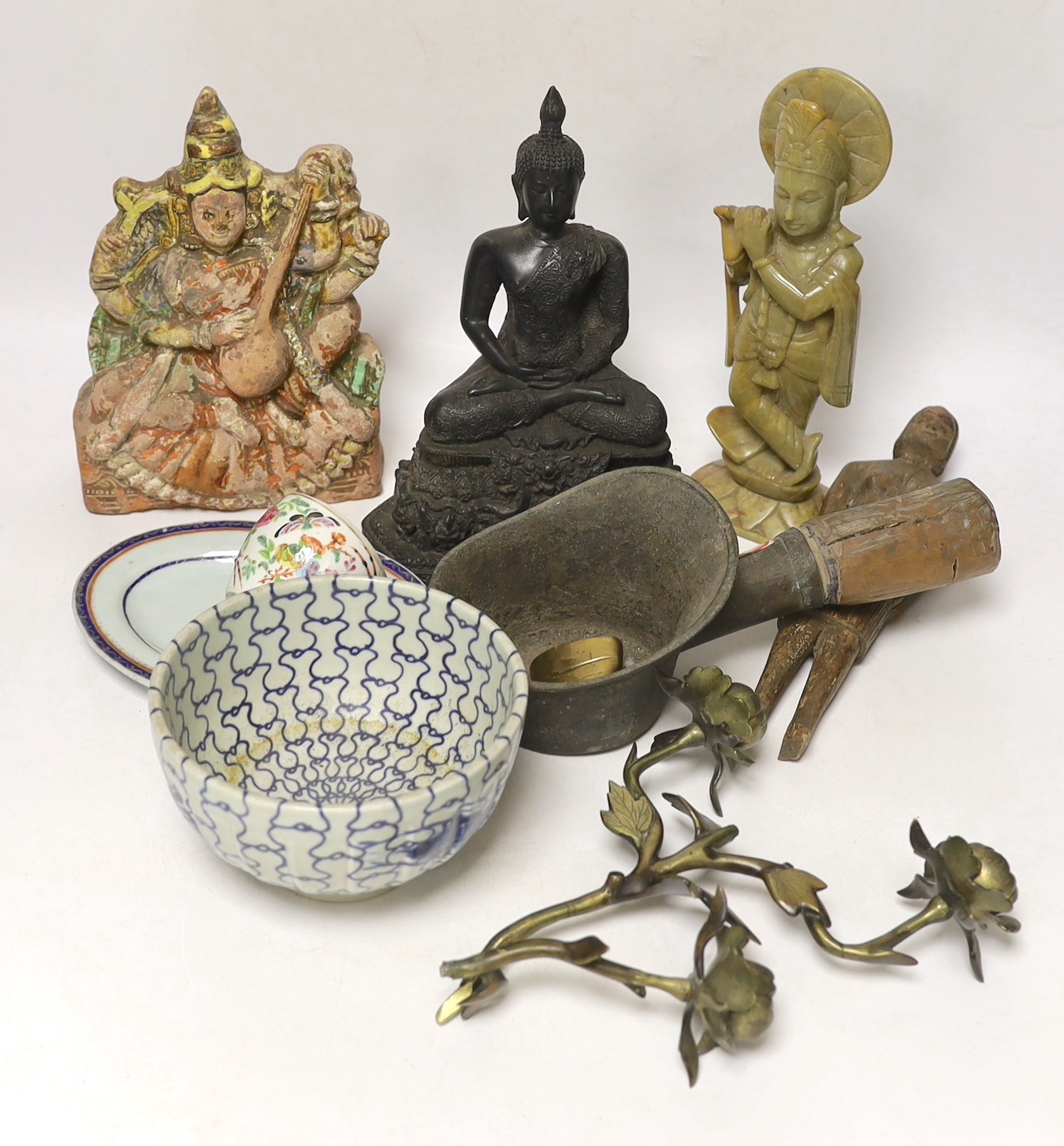 A Thai composite Buddha, 22cm high, an African carved wood female figure, an iron, a small bronze Buddha, an Indian soapstone carved figure of Krishna and a terracotta figure of Saraswati, together with Chinese ceramics,